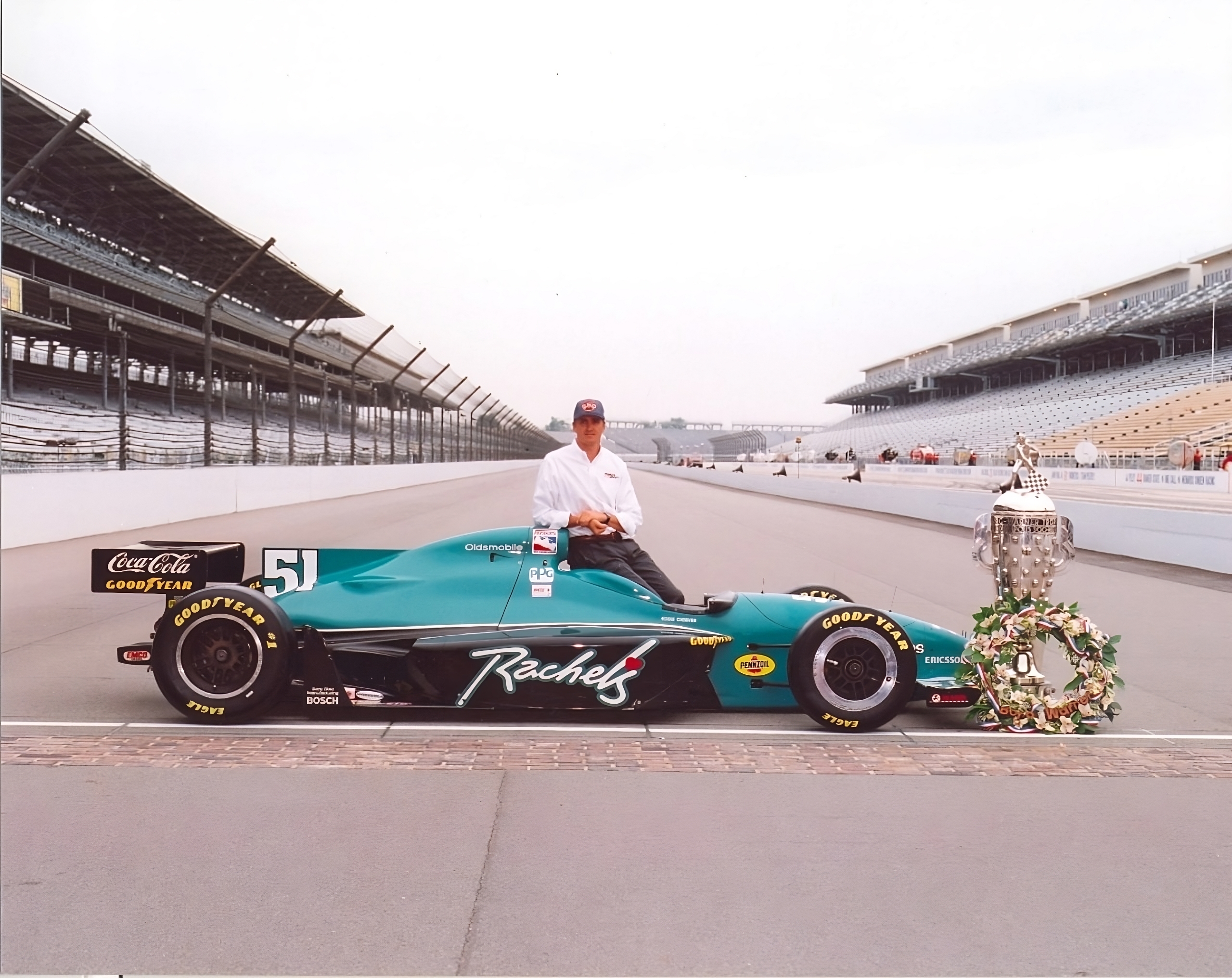 Eddie Cheever and his trophy with his Dallara IR8